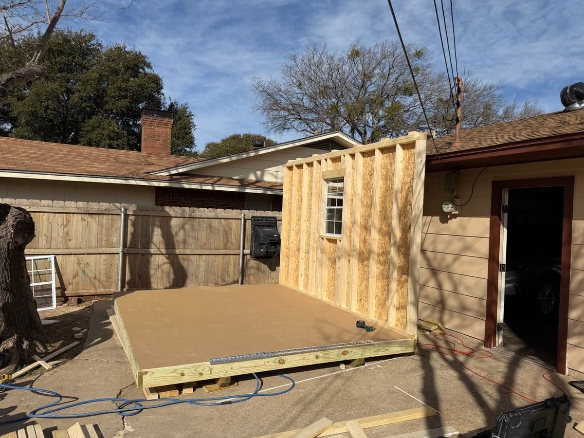 First wall being raised with studs and window frame