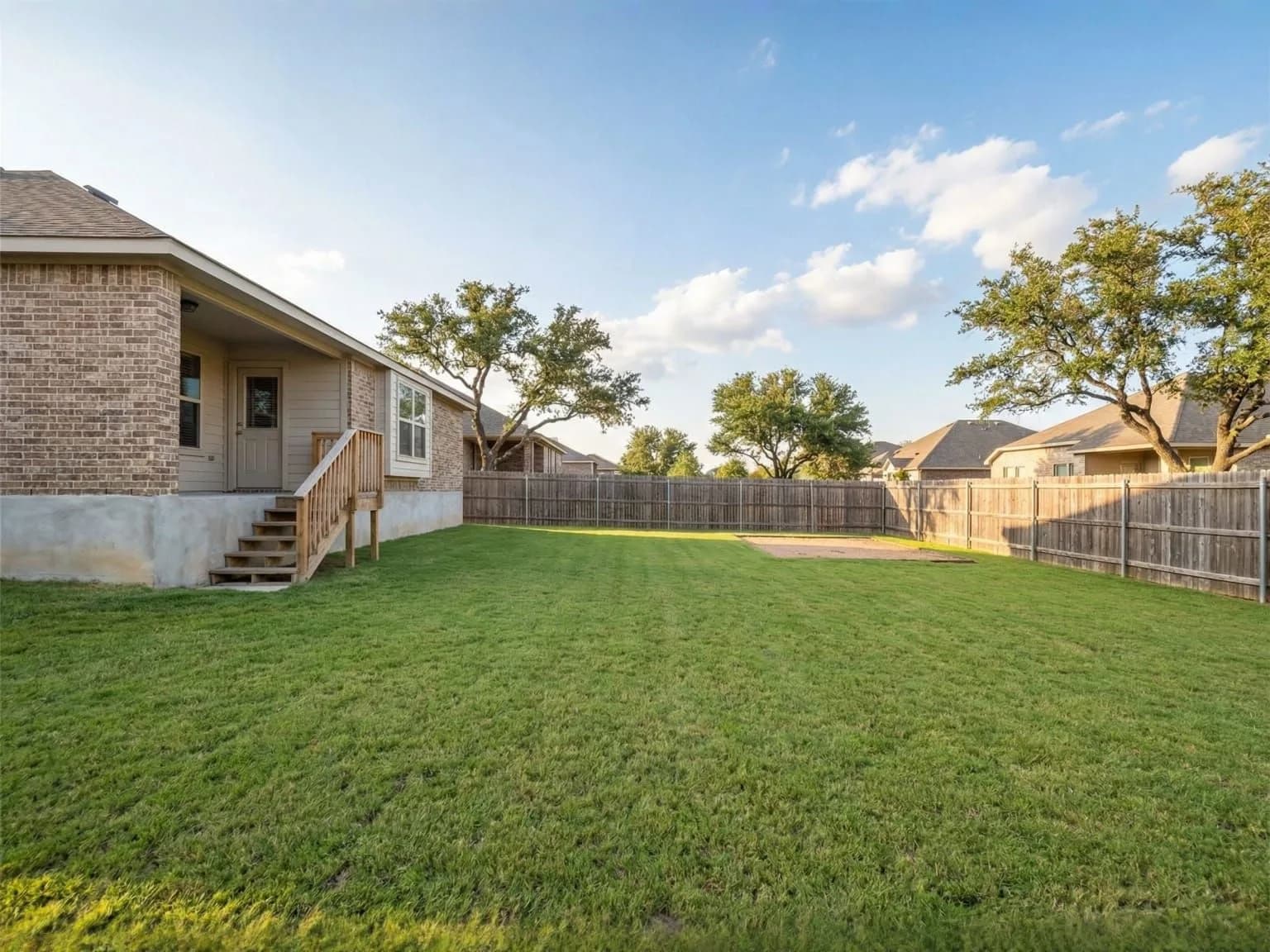 Empty backyard before adding a shed or steel building